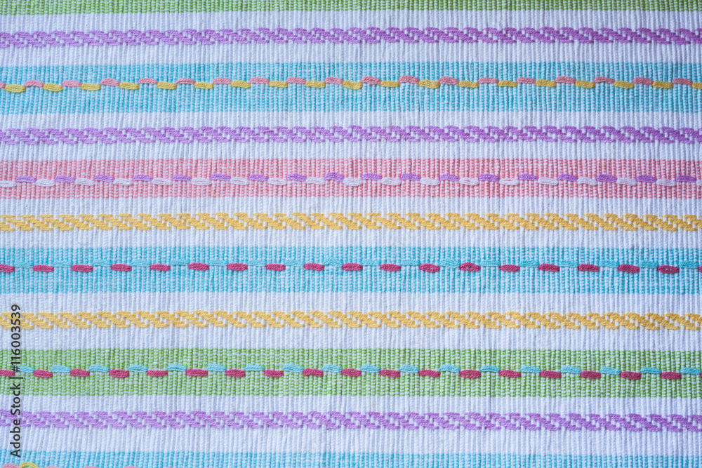 Close up view of colorful fabric tablecloth with stripe line