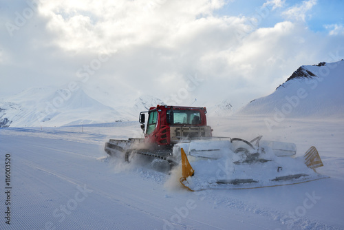 snowcat rides to work in the evening