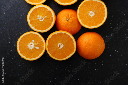 fresh oranges on dark background