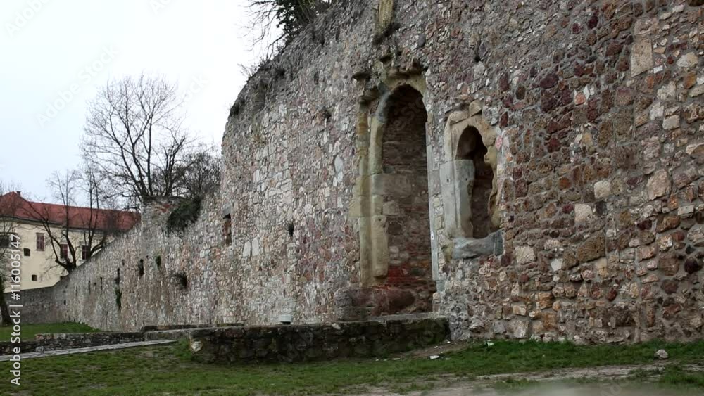 man jumps from a window of a medieval castle