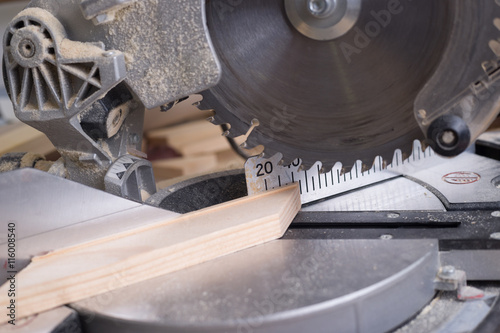 Carpenter tools on wooden table with sawdust. Circular Saw.