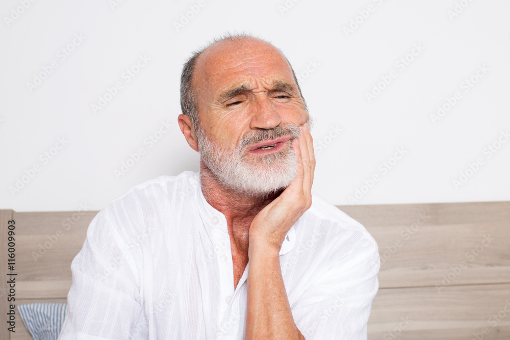 Elderly man suffering from toothache Elderly man suffering from toothache
