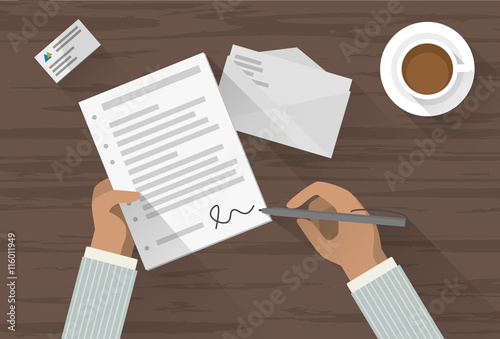 Man signing a paper
