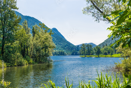 Lake of Ghirla, Valganna - Italy. The lake is a tourist location located in Valganna near Cunardo in the province of Varese. In the background the mountain Poncione of Ganna with a cross on top photo