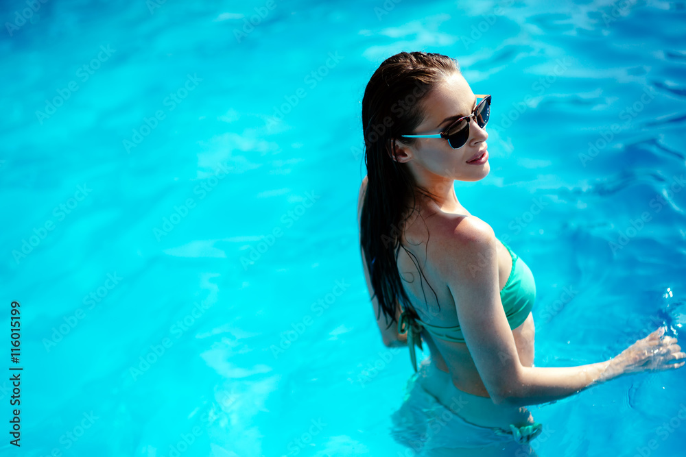 Attractive brunette in pool