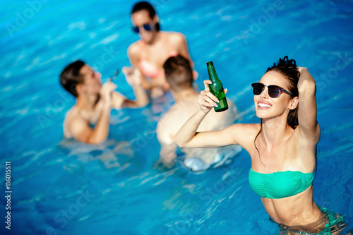 Group of people partying in pool