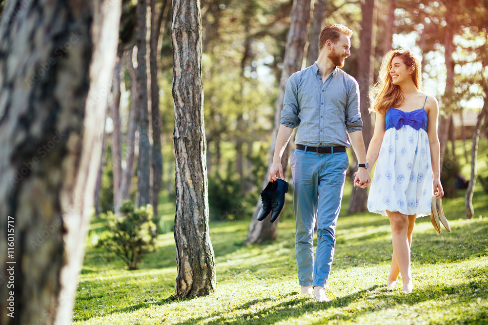 Romantic couple walking forest