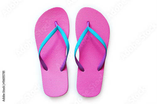 Pink flip flops isolated on white background. Top view photo