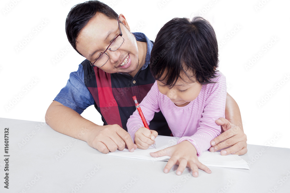 Dad teaching his daughter to study Dad teaching his daughter to study