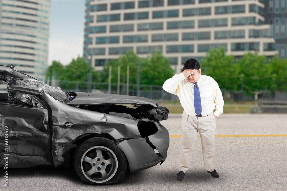 Stressful businessman after car accident Stressful businessman after car accident