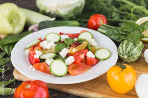 Closeup of vegan tomato, basil and cheese salad recipe.