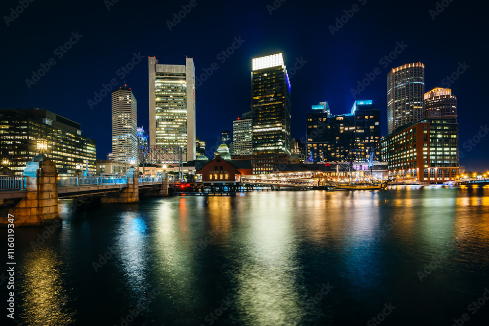 The downtown skyline at night, seen from Fort Point in Boston, M