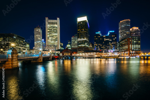 The downtown skyline at night  seen from Fort Point in Boston  M