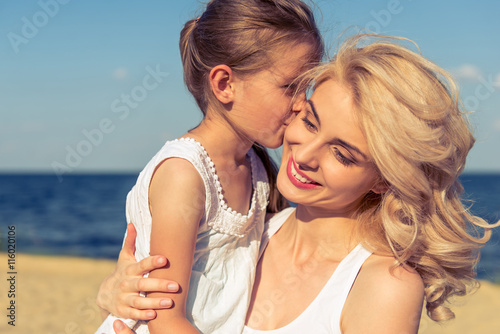 Mom and daughter on the beach