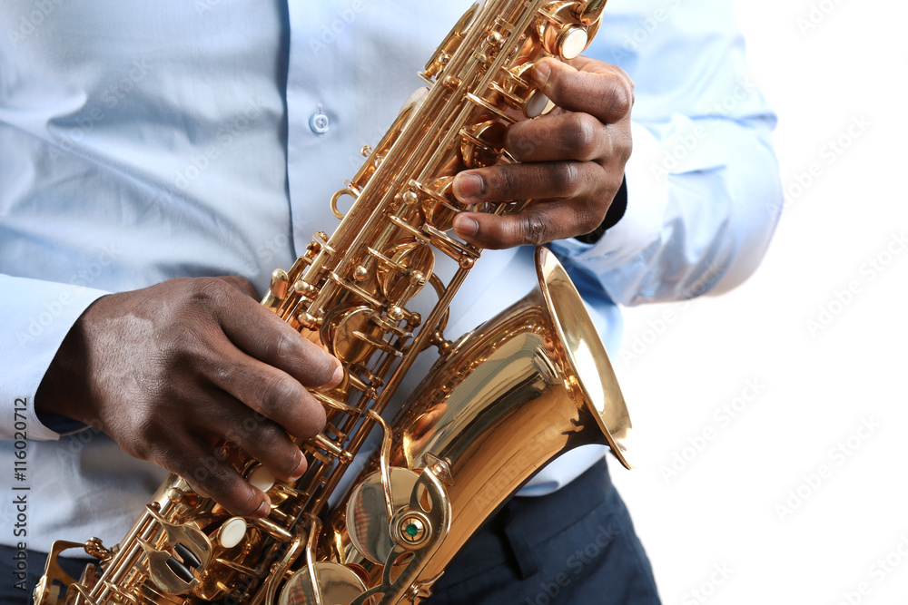Fototapeta premium African American jazz musician playing the saxophone, closeup