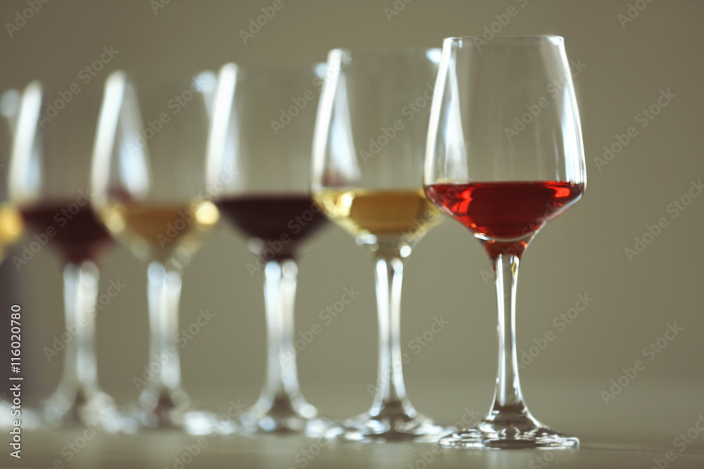 Many glasses of different wine in a row, close up Many glasses of different wine in a row, close up