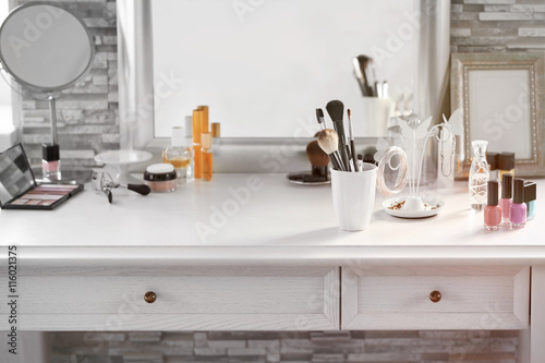 Photo Cosmetic set on light dressing table