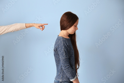 Family problems concept. Mother punishing daughter