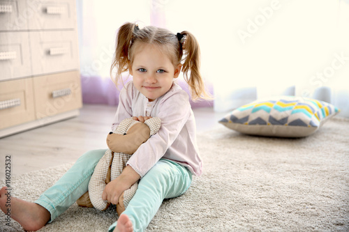 Small cute girl with teddy ...