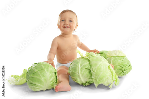 Cute baby girl with cabbage...