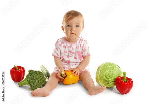 Cute baby girl with vegetab...