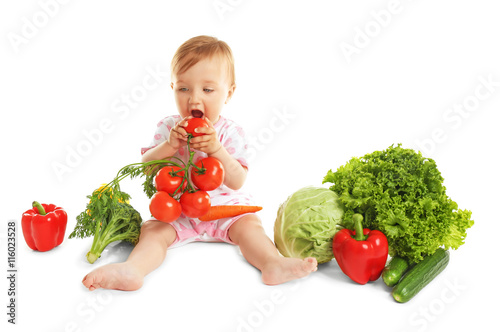Cute baby girl with vegetab...