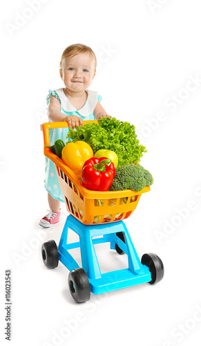 Cute baby girl with vegetab...
