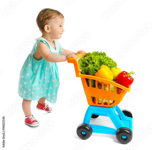 Cute baby girl with vegetab...