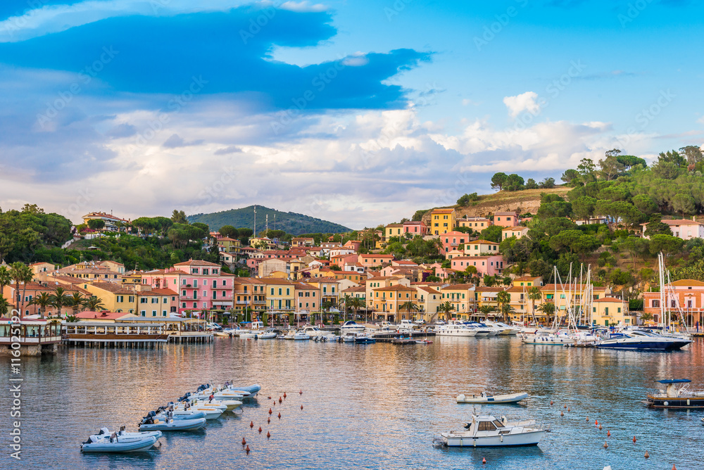 Panoramic view over the famous attraction port of  Porto Azzurro at sunset, in Italy - Elba island