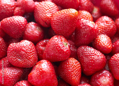 Fresh red bright strawberries. Macro, top view/A background of fresh strawberries fruit, close up