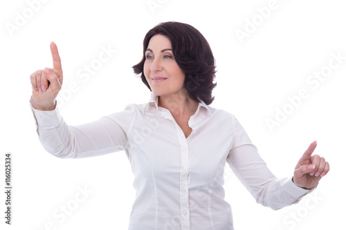 portrait of mature business woman pointing at something isolated