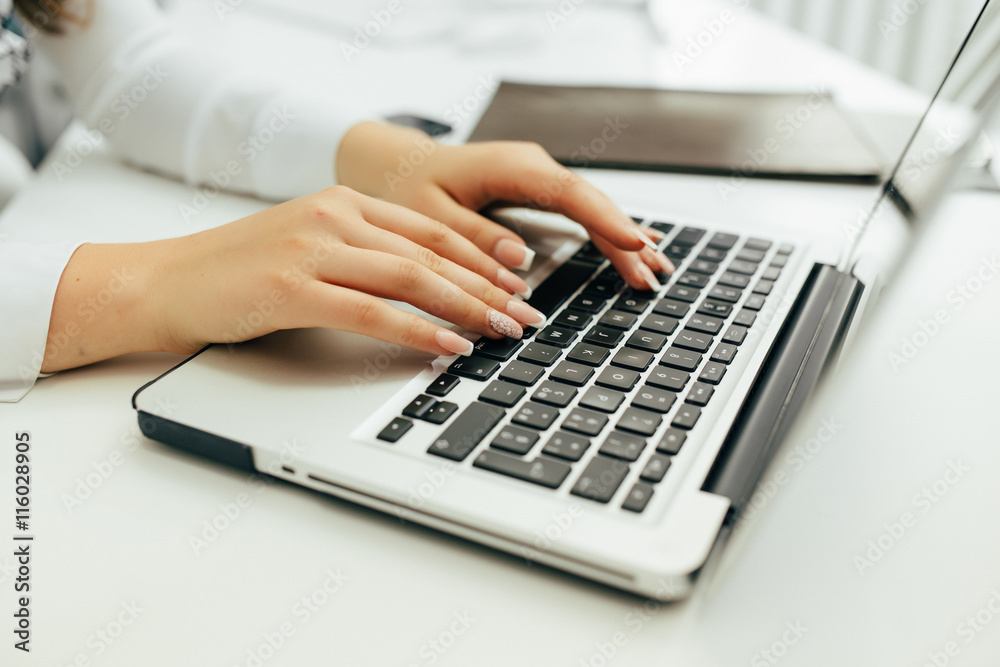 Close up of working woman hands on laptop Close up of working woman hands on laptop