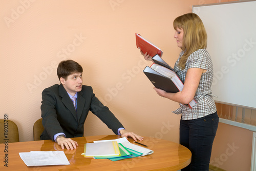 Secretary gives a folders to the chief