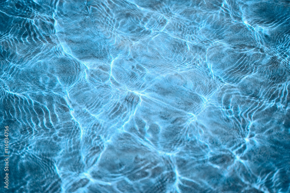 Abstract blue background - sunlight on a water surface Abstract blue background - sunlight on a water surface