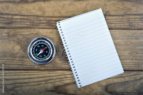 Compass on wooden table