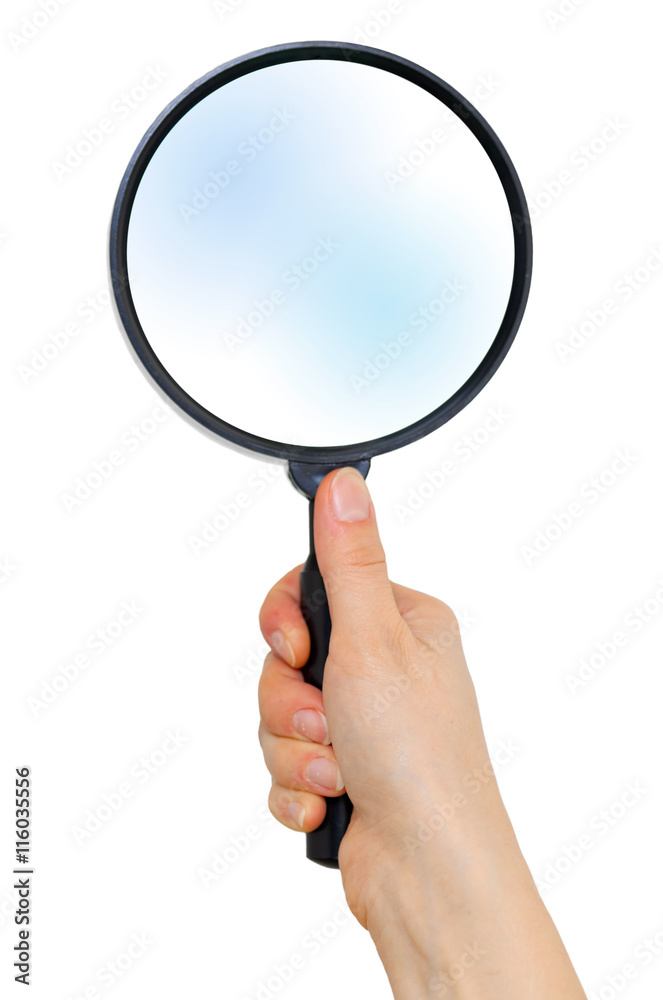 Female hand holds big magnifier isolated on white background Female hand holds big magnifier isolated on white background