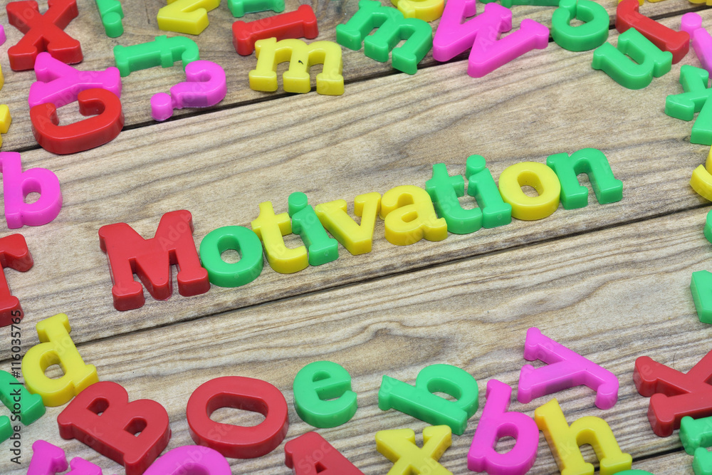 Fototapeta premium Motivation on wooden table