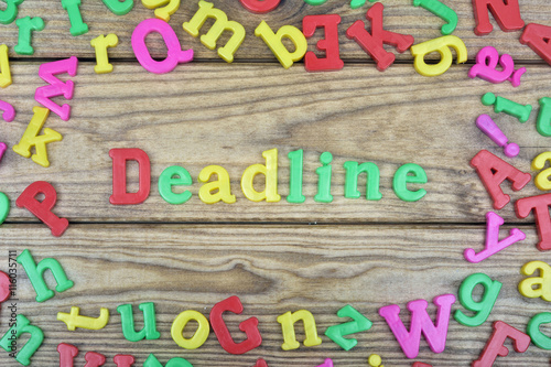 Deadline on wooden table