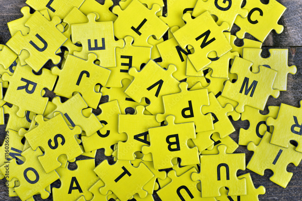 Puzzle on wooden table Puzzle on wooden table