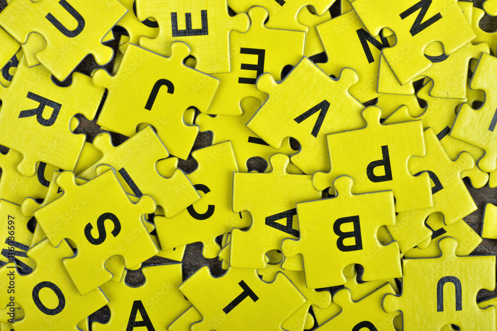 Puzzle on wooden table Puzzle on wooden table