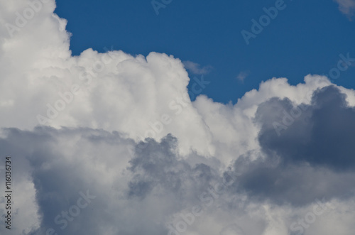 Billowing Cumulus Clouds Boiling in the Bright Blue Summer Sky