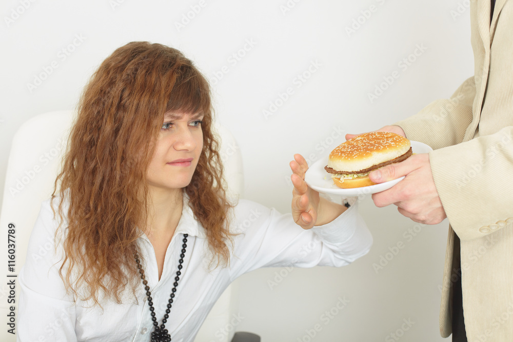 Young beautiful woman refuses harmful food Young beautiful woman refuses harmful food