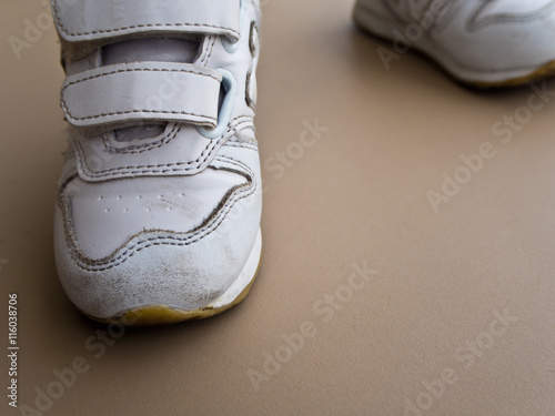 Closeup of children foot walking in sport shoes