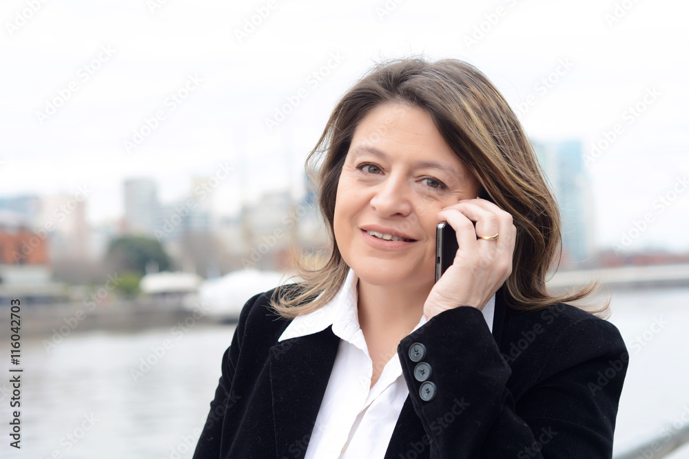 Close up of business woman talking on her smartphone. Close up of business woman talking on her smartphone.