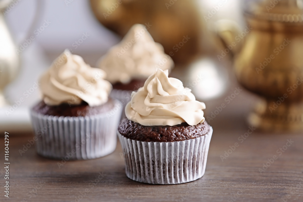Tasty cupcake on wooden table Tasty cupcake on wooden table