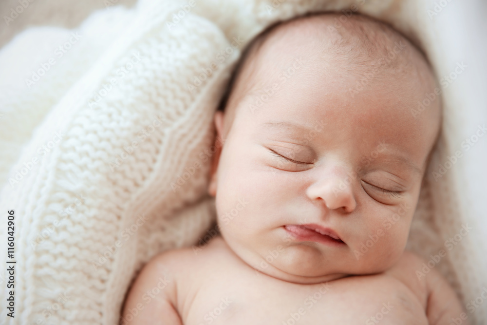 Newborn baby girl, 7 days old, sleeping on soft fluffy blanket Newborn baby girl, 7 days old, sleeping on soft fluffy blanket