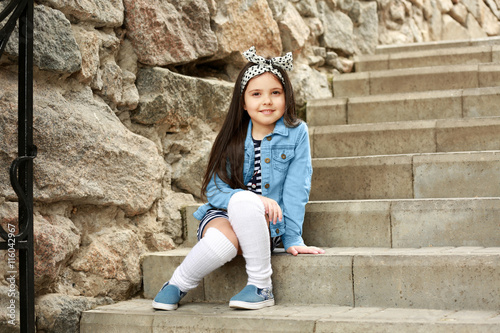 Little girl wearing stylish...