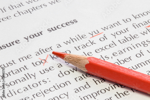 Red pencil proofreading concept