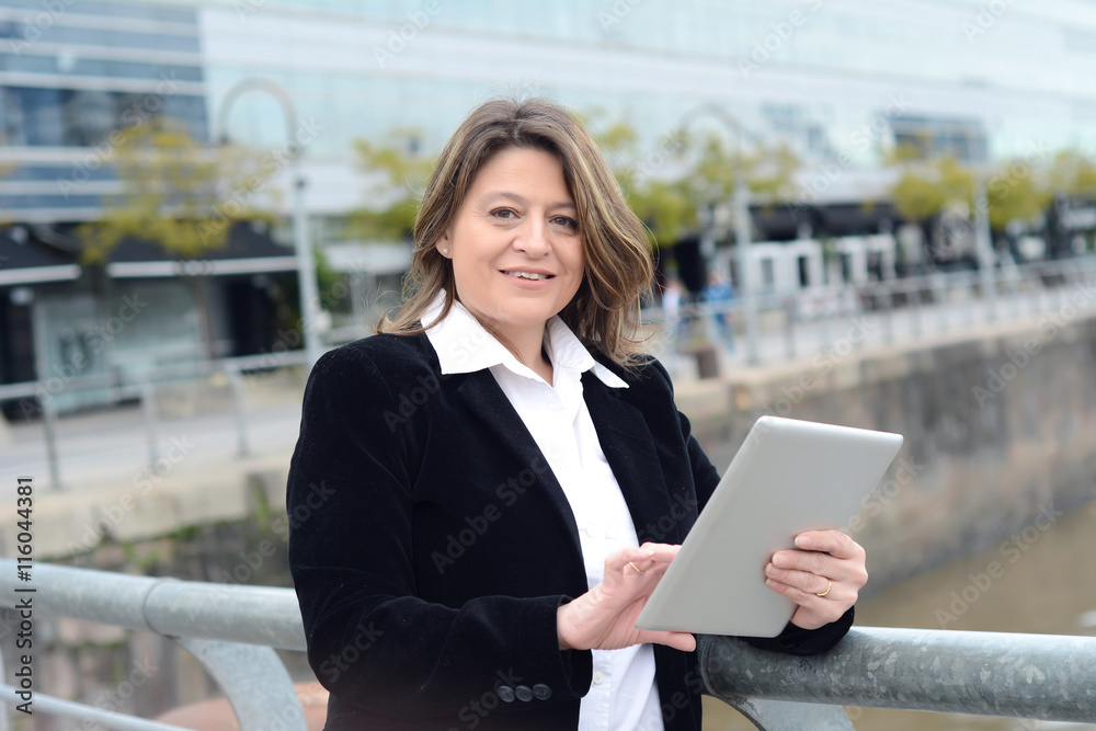 Portrait of business woman using her tablet. Portrait of business woman using her tablet.