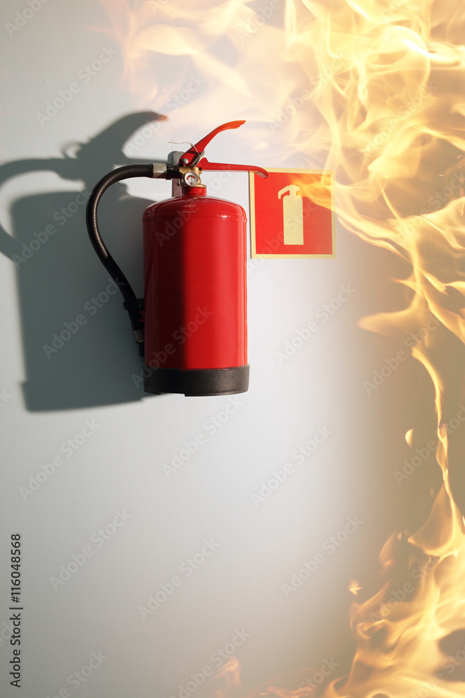 Fototapeta premium fire in the building and a fire extinguisher